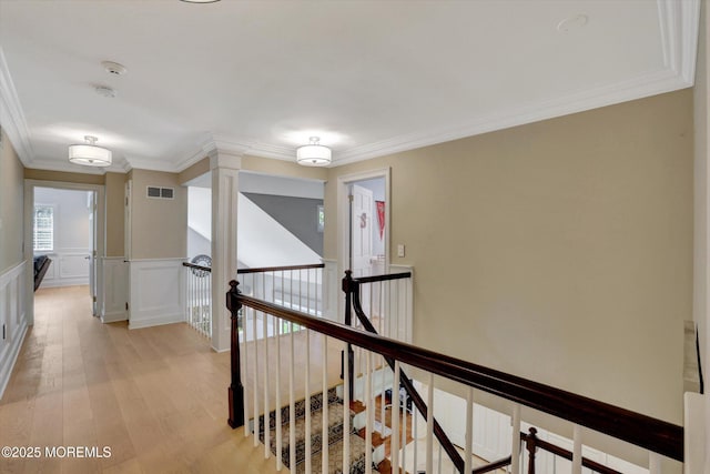 12 Wagon Way, Holmdel, NJ 07733 - corridor featuring an upstairs landing, ornamental molding, light wood finished floors, a wainscoted wall, and a decorative wall