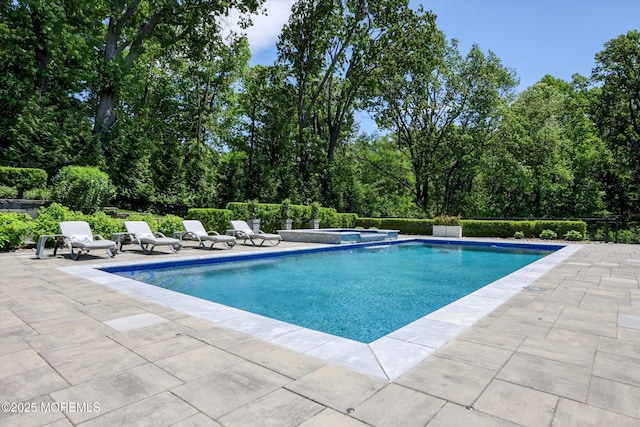 12 Wagon Way, Holmdel, NJ 07733 - view of pool featuring a patio area, a pool with connected hot tub, and view of scattered trees