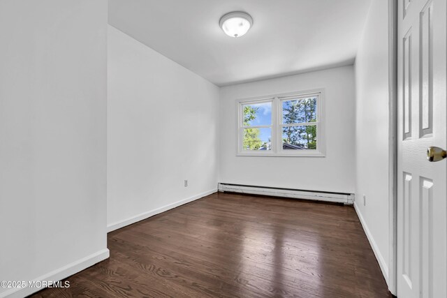 1324 Sixth Ave, Toms River, NJ 08757 - unfurnished room with baseboard heating, wood finished floors, and baseboards