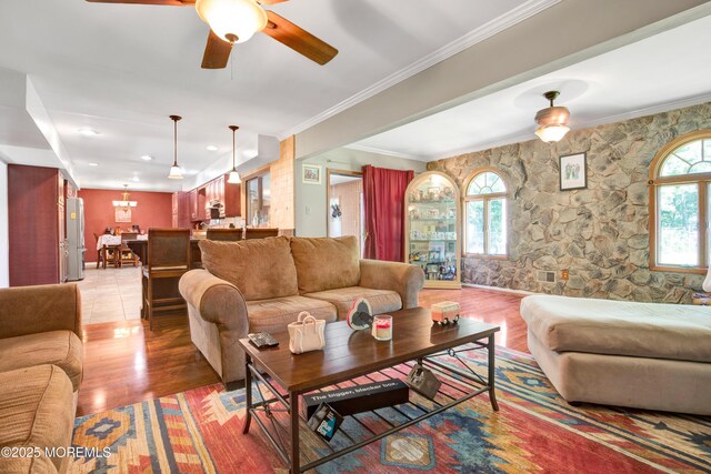 16 Markwood Dr, Howell, NJ 07731 - living room with light wood finished floors, crown molding, and a ceiling fan