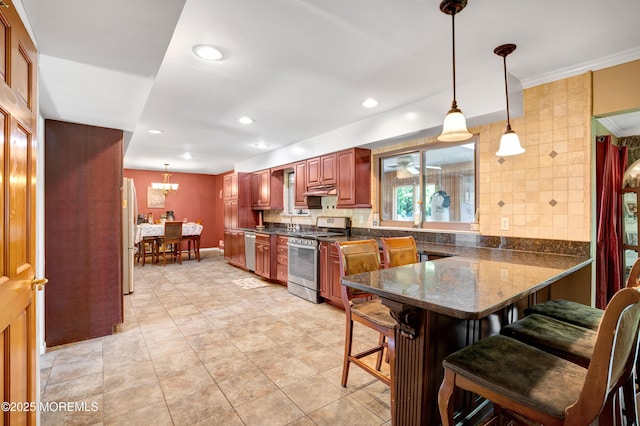 16 Markwood Dr, Howell, NJ 07731 - kitchen featuring stainless steel appliances, a kitchen breakfast bar, a peninsula, pendant lighting, and ornamental molding