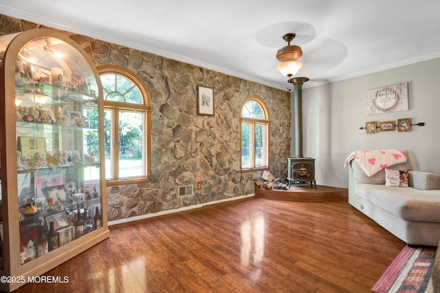 16 Markwood Dr, Howell, NJ 07731 - living area with a wood stove, wood finished floors, and crown molding