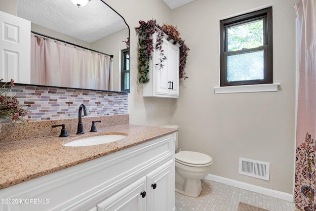 16 Markwood Dr, Howell, NJ 07731 - full bathroom with baseboards, vanity, tile patterned floors, toilet, and backsplash