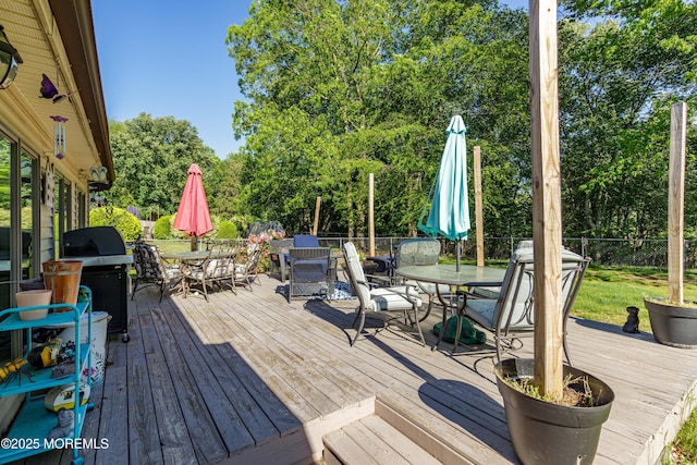 16 Markwood Dr, Howell, NJ 07731 - wooden deck with outdoor dining area, area for grilling, and view of scattered trees