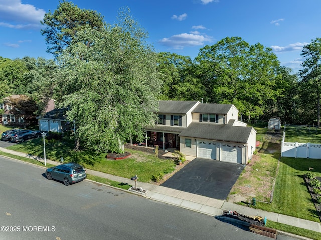 16 Markwood Dr, Howell, NJ 07731 - view of front of property featuring asphalt driveway, a porch, and roof with shingles