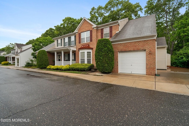 6 Foxmoor Ln, Bayville, NJ 08721 - view of front of property featuring brick siding, a garage, asphalt driveway, and covered porch