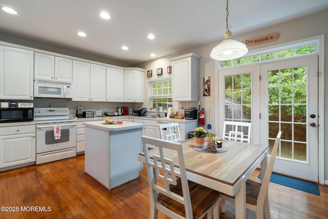 6 Foxmoor Ln, Bayville, NJ 08721 - kitchen featuring white appliances, a center island, decorative light fixtures, recessed lighting, and white cabinets