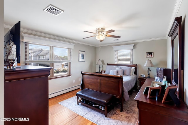 660 Fairview Ln, Forked River, NJ 08731 - bedroom featuring a baseboard radiator, ornamental molding, wood finished floors, and a ceiling fan