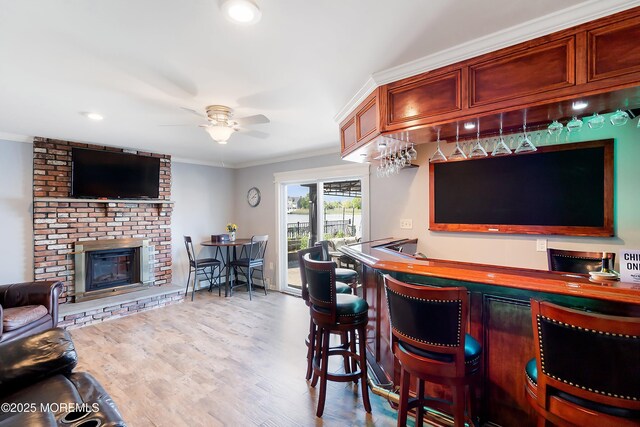 660 Fairview Ln, Forked River, NJ 08731 - indoor dry bar with a brick fireplace, crown molding, ceiling fan, wood finished floors, and recessed lighting