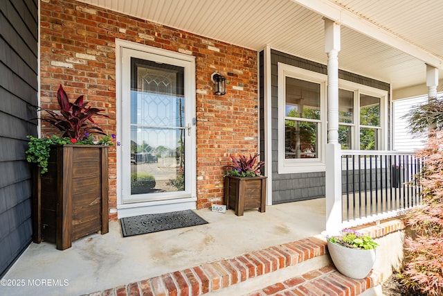 660 Fairview Ln, Forked River, NJ 08731 - view of exterior entry featuring covered porch and brick siding