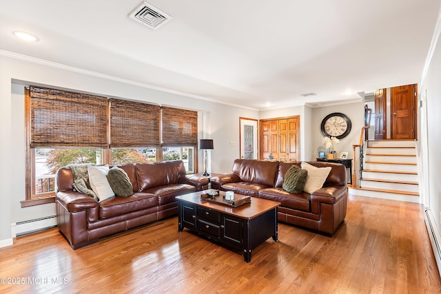660 Fairview Ln, Forked River, NJ 08731 - living area with baseboard heating, crown molding, light wood-type flooring, and stairs