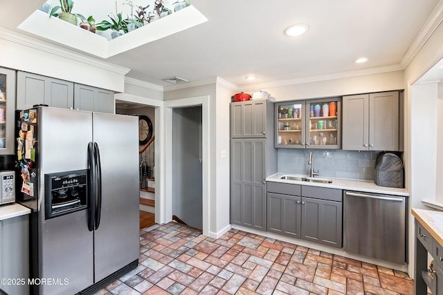 660 Fairview Ln, Forked River, NJ 08731 - kitchen with appliances with stainless steel finishes, gray cabinets, a sink, brick patterned flooring, and ornamental molding