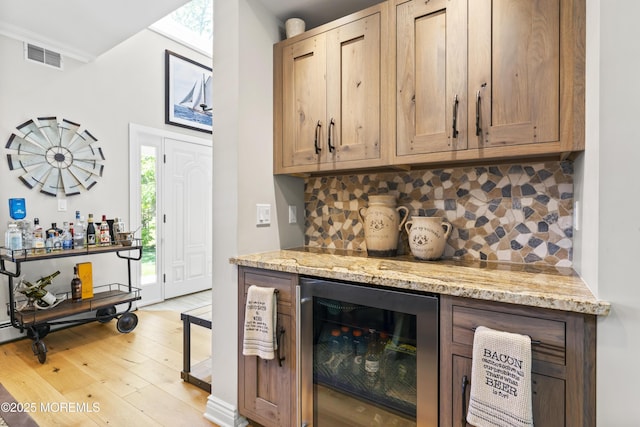 274 Beachview Ave, Manahawkin, NJ 08050 - indoor dry bar with beverage cooler, decorative backsplash, and light wood-style flooring