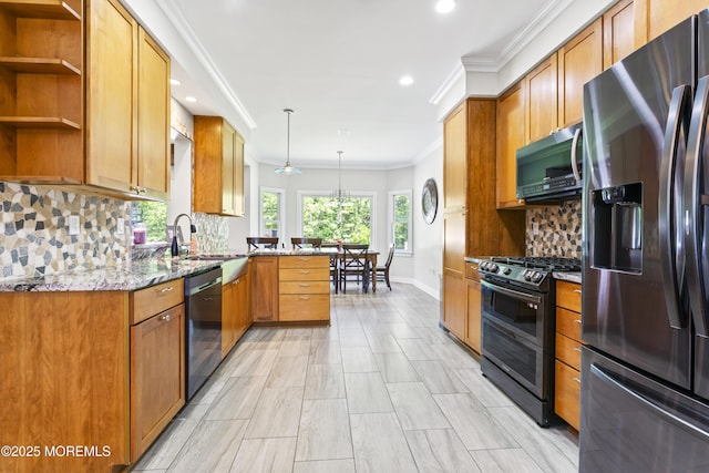 274 Beachview Ave, Manahawkin, NJ 08050 - kitchen with appliances with stainless steel finishes, a sink, light stone counters, crown molding, and decorative backsplash