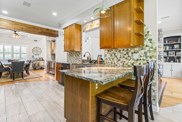 274 Beachview Ave, Manahawkin, NJ 08050 - kitchen featuring open shelves, brown cabinetry, ornamental molding, a sink, and a ceiling fan