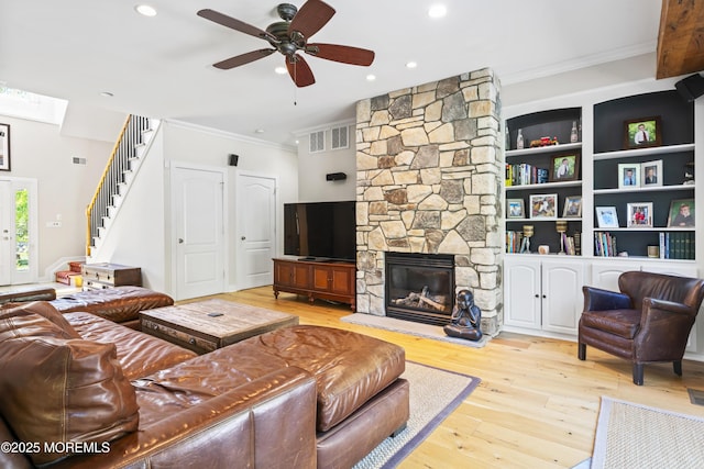 274 Beachview Ave, Manahawkin, NJ 08050 - living area with crown molding, a ceiling fan, wood-type flooring, a stone fireplace, and recessed lighting