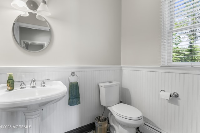 274 Beachview Ave, Manahawkin, NJ 08050 - bathroom featuring wainscoting, toilet, a sink, and a baseboard radiator