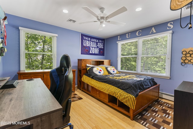 274 Beachview Ave, Manahawkin, NJ 08050 - bedroom featuring baseboard heating, multiple windows, wood finished floors, a desk, and recessed lighting