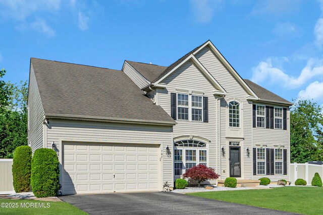 707 Cedar Point Ct, Toms River, NJ 08753 - view of front facade featuring driveway, an attached garage, and roof with shingles