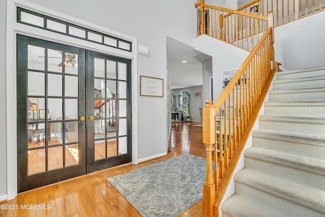 707 Cedar Point Ct, Toms River, NJ 08753 - entrance foyer with wood-type flooring, stairway, baseboards, french doors, and a towering ceiling