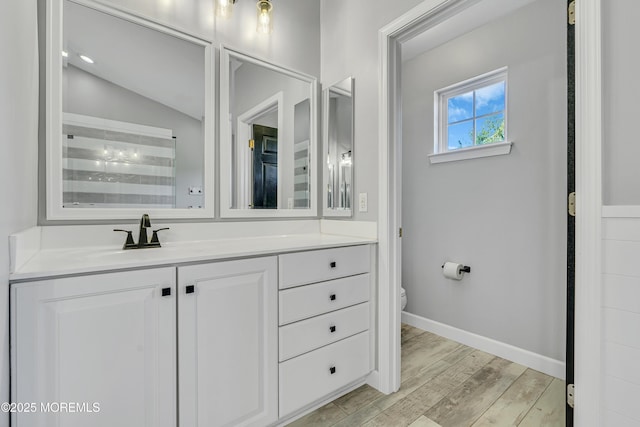 707 Cedar Point Ct, Toms River, NJ 08753 - full bathroom with vanity, toilet, wood finished floors, and baseboards