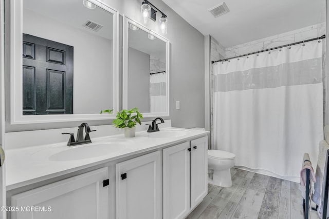 707 Cedar Point Ct, Toms River, NJ 08753 - bathroom featuring toilet, double vanity, wood finished floors, and a shower with curtain