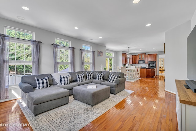 707 Cedar Point Ct, Toms River, NJ 08753 - living area featuring light wood finished floors, recessed lighting, a chandelier, and baseboards