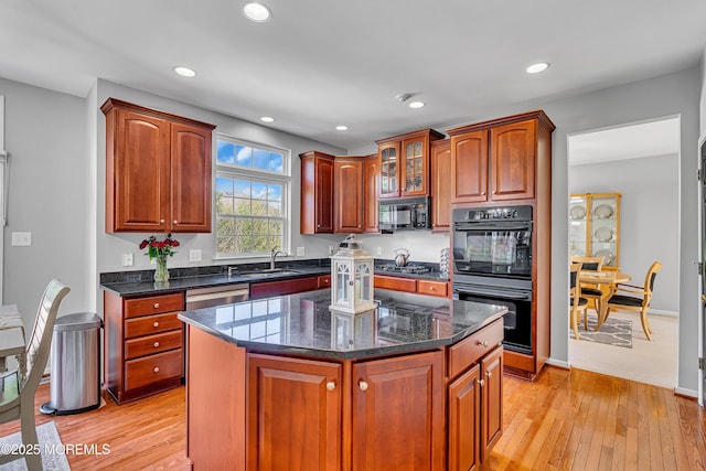 707 Cedar Point Ct, Toms River, NJ 08753 - kitchen with black appliances, a sink, light wood-type flooring, recessed lighting, and dark stone countertops
