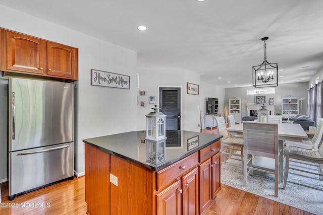 707 Cedar Point Ct, Toms River, NJ 08753 - kitchen with freestanding refrigerator, light wood-style floors, open floor plan, a kitchen island, and a chandelier