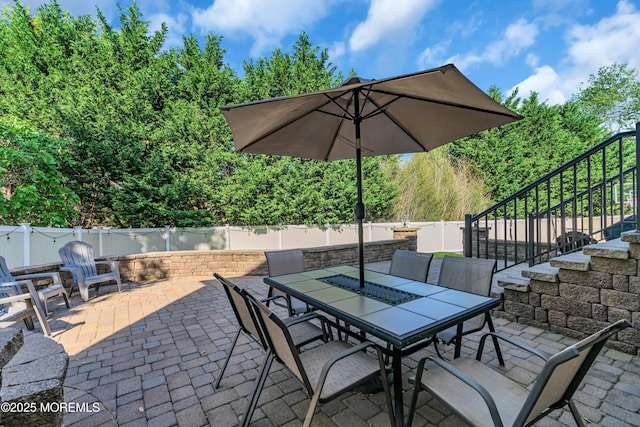 707 Cedar Point Ct, Toms River, NJ 08753 - fenced backyard with stairs, a patio area, and outdoor dining area