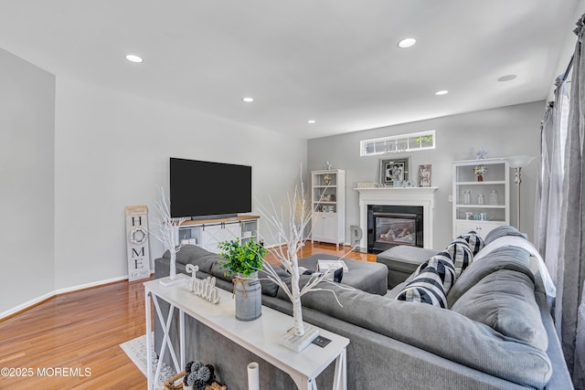 707 Cedar Point Ct, Toms River, NJ 08753 - living area featuring wood finished floors, recessed lighting, a fireplace with flush hearth, and baseboards