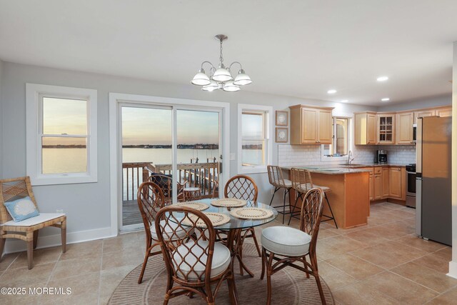 151 Shore Dr, Brick, NJ 08723 - dining room featuring a chandelier, light tile patterned floors, recessed lighting, and baseboards