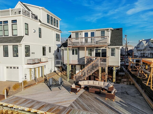151 Shore Dr, Brick, NJ 08723 - rear view of property featuring an outdoor living space, a wooden deck, a balcony, a residential view, and an attached garage