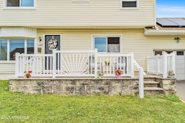 39 Scholer Dr, Union Beach, NJ 07735 - entrance to property with roof mounted solar panels and a yard