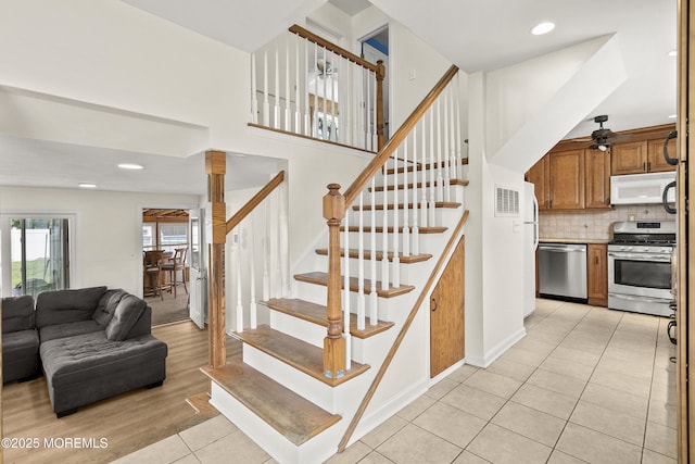 39 Scholer Dr, Union Beach, NJ 07735 - stairway featuring a ceiling fan, tile patterned flooring, recessed lighting, and a high ceiling