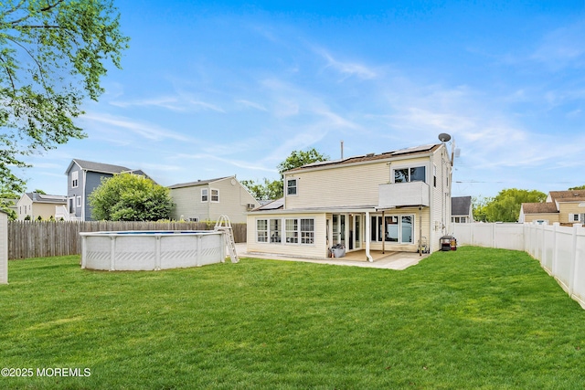 39 Scholer Dr, Union Beach, NJ 07735 - back of house with solar panels and a patio area