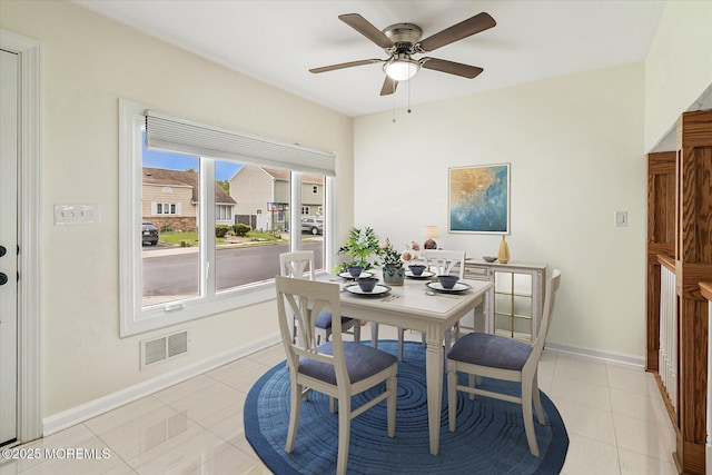 39 Scholer Dr, Union Beach, NJ 07735 - dining area featuring light tile patterned flooring, a ceiling fan, and baseboards