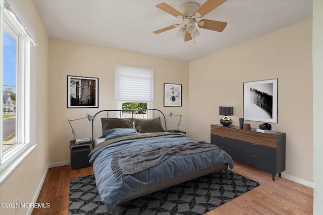 39 Scholer Dr, Union Beach, NJ 07735 - bedroom featuring multiple windows, baseboards, and light wood-style floors