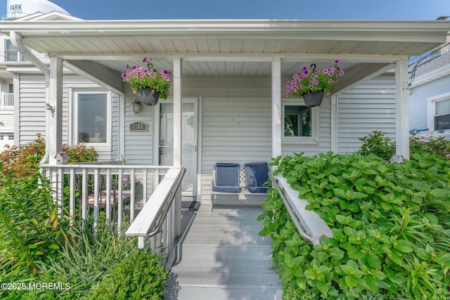 1707-1705 N Bayview Ave, Seaside Park, NJ 08752 - view of exterior entry featuring a porch