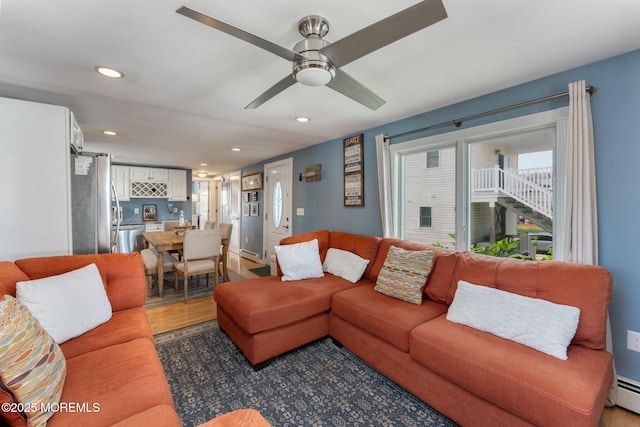 1707-1705 N Bayview Ave, Seaside Park, NJ 08752 - living area featuring recessed lighting, a baseboard heating unit, ceiling fan, and light wood-style flooring