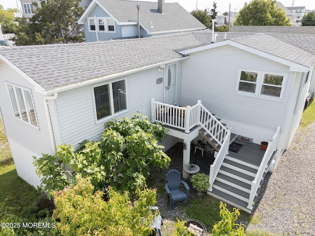 1707-1705 N Bayview Ave, Seaside Park, NJ 08752 - rear view of house featuring a shingled roof, a deck, and stairs