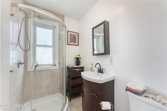 1707-1705 N Bayview Ave, Seaside Park, NJ 08752 - bathroom featuring healthy amount of natural light, vanity, a shower stall, and toilet