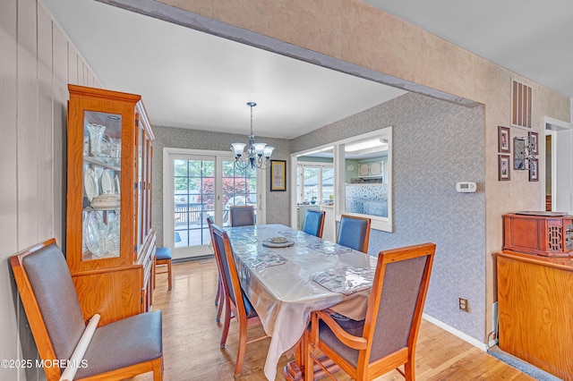 14 N Longview Rd, Howell, NJ 07731 - dining room featuring wallpapered walls, light wood-style flooring, a chandelier, and baseboards