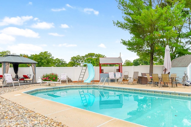14 N Longview Rd, Howell, NJ 07731 - view of swimming pool with a water slide, a gazebo, a fenced backyard, and a patio