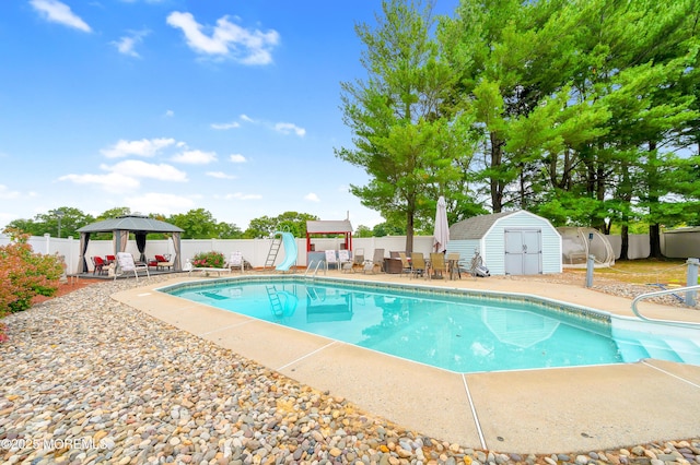 14 N Longview Rd, Howell, NJ 07731 - view of pool featuring a water slide, a gazebo, a patio area, a fenced backyard, and outdoor dining area