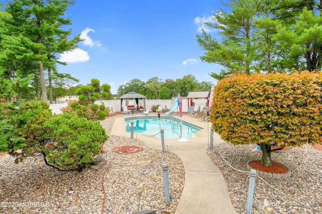 14 N Longview Rd, Howell, NJ 07731 - view of pool with a water slide, a fenced backyard, a playground, and a patio