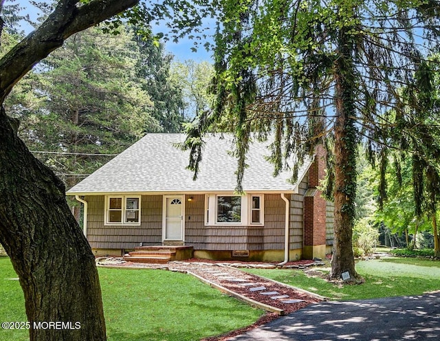 2897 State Route 138, Wall, NJ 07719 - view of front of home with roof with shingles and a front lawn