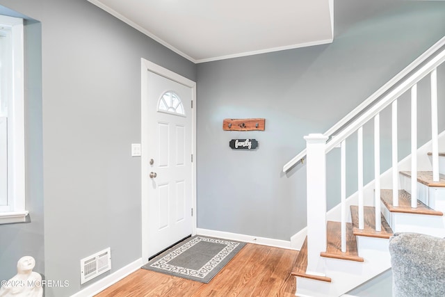 2897 State Route 138, Wall, NJ 07719 - entrance foyer with wood finished floors, ornamental molding, stairway, and baseboards