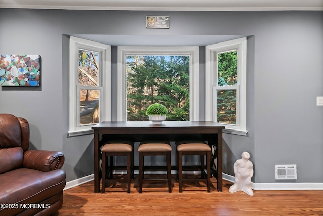 2897 State Route 138, Wall, NJ 07719 - dining area featuring wood finished floors, baseboards, and ornamental molding