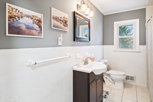 2897 State Route 138, Wall, NJ 07719 - bathroom with tile walls, vanity, tile patterned floors, toilet, and crown molding